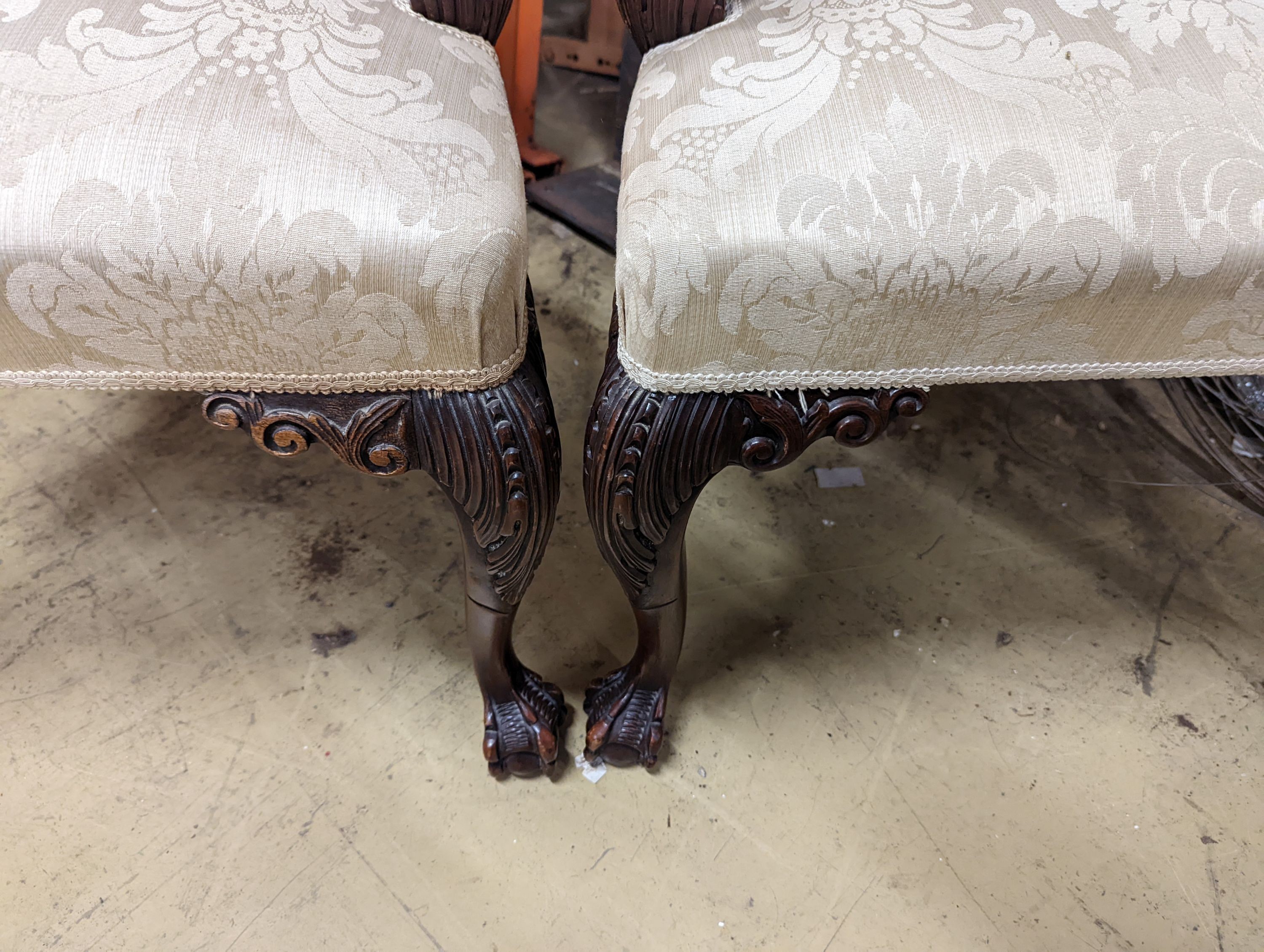 A pair of Chippendale revival mahogany elbow chairs, width 60cm, depth 50cm, height 102cm